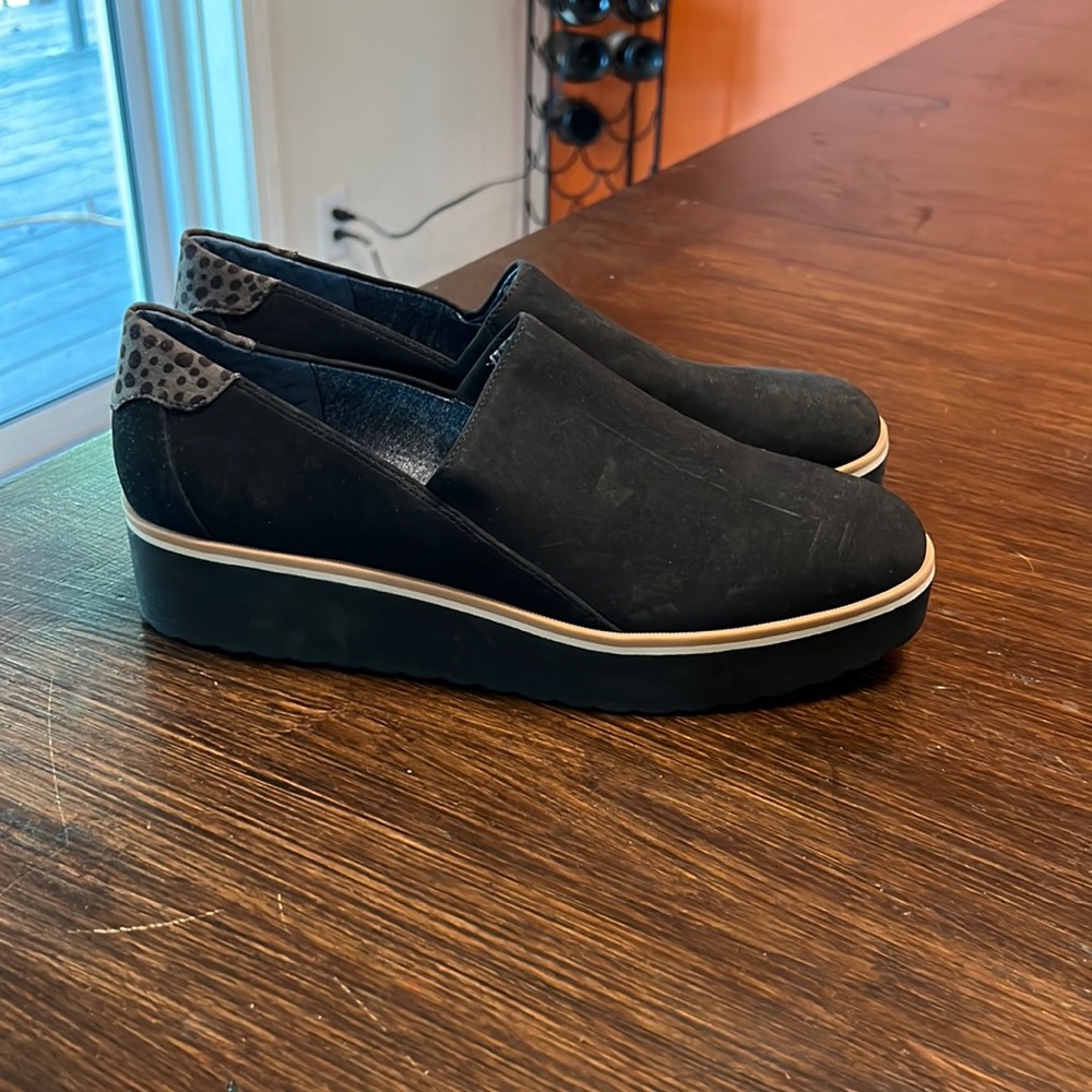 Dr. Scholl’s black wedge slip on shoe.  Never worn.  Size 10.
